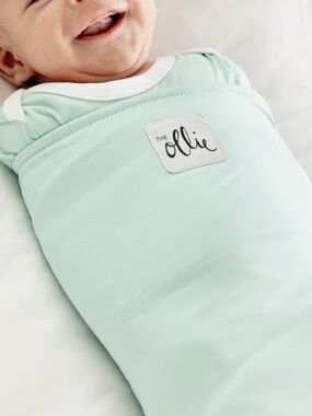 The Ollie® Swaddle helps your little one sleep longer, deeper.